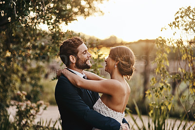 Buy stock photo Happy married couple, hug and smile for wedding, marriage or commitment in relationship together in nature. Groom and bride hugging, smiling and embracing love, vows or honeymoon adventure outside