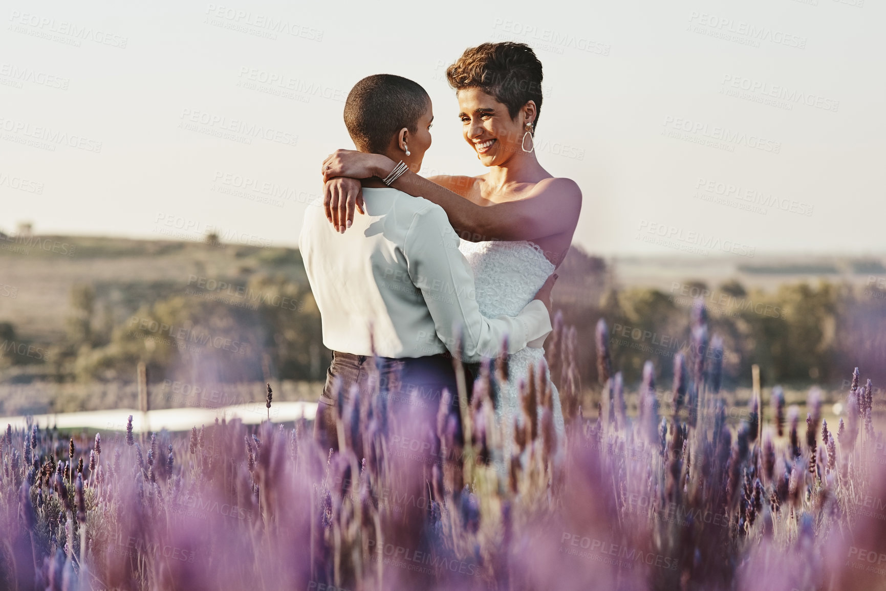 Buy stock photo Woman, lesbian couple and hug in embrace for LGBT relationship, wedding or marriage commitment in nature. Happy gay married women hugging, smiling and enjoying romantic celebration in the countryside