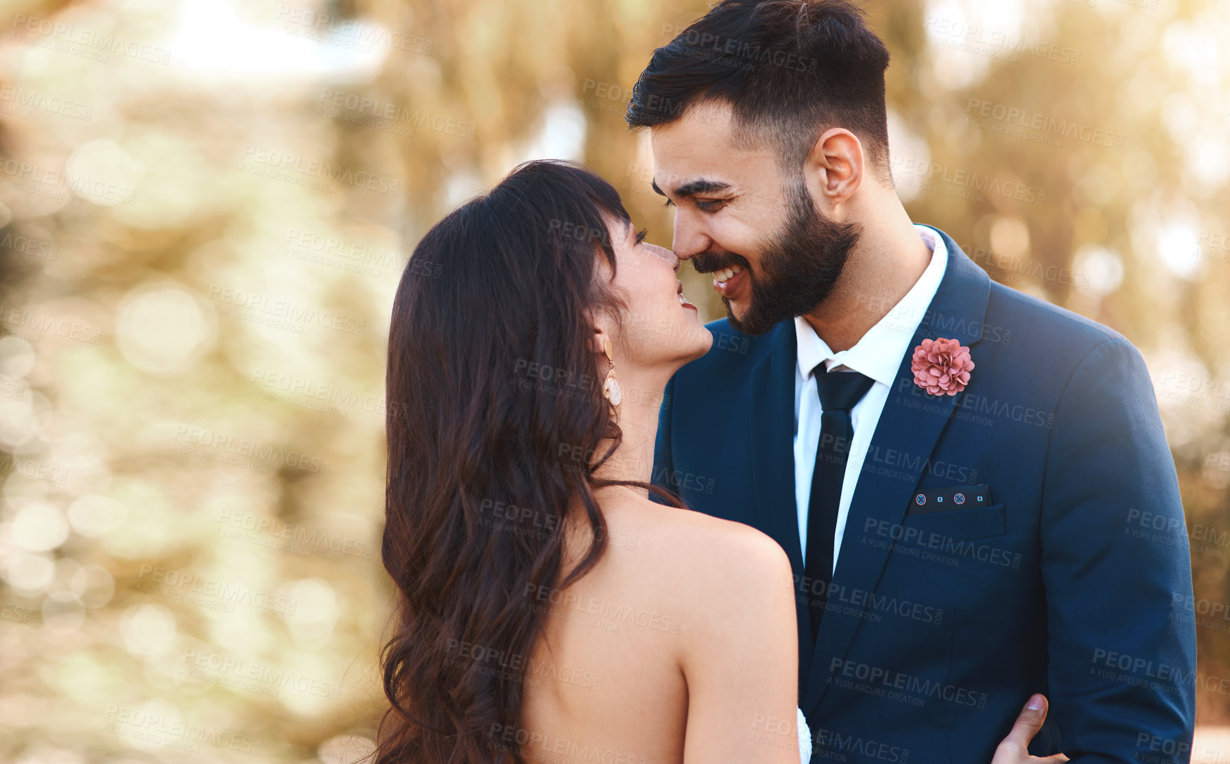 Buy stock photo Shot of a young couple standing together on their wedding day