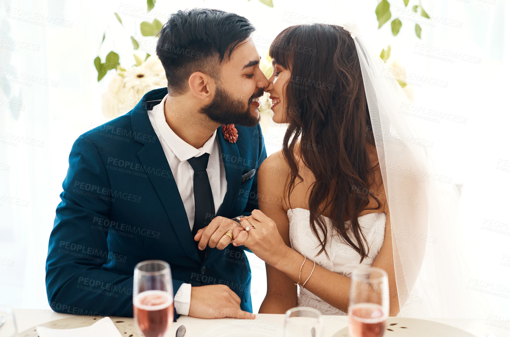 Buy stock photo Cropped shot of a newlywed couple sitting together at their wedding reception