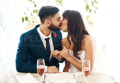 Buy stock photo Cropped shot of a newlywed couple sitting together at their wedding reception