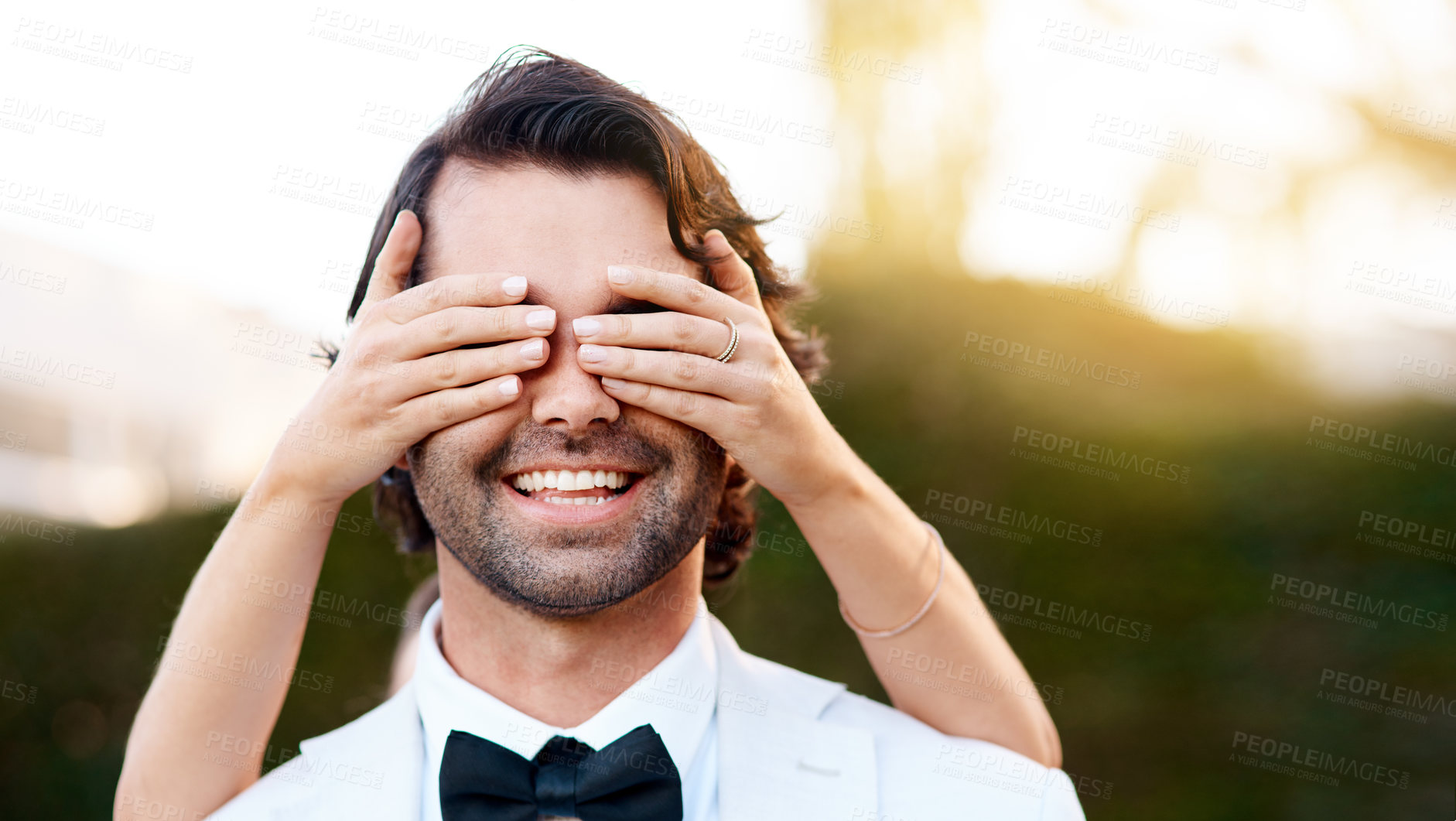 Buy stock photo Couple, wedding and surprise with hands on eyes for happy reveal at ceremony or love, excited and commitment. Bride, man or woman, smile for event celebration and outdoor for marriage while playing 