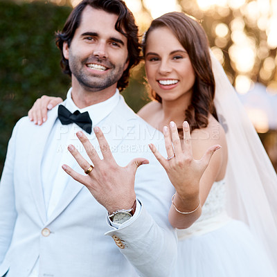 Buy stock photo Cropped shot of a newlywed couple showing off their wedding rings