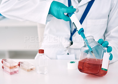Buy stock photo Cropped shot of an unrecognizable female scientist using a dropper while conducting an experiment in a laboratory