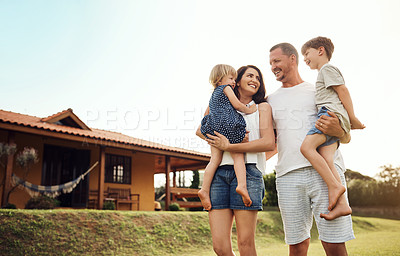 Buy stock photo Shot of a happy family bonding together outdoors