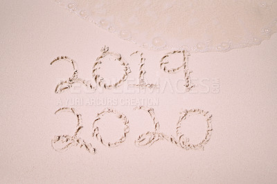 Buy stock photo Still life shot of the years 2019 and 2020 written on sand on a beach in Raja Ampat, Indonesia