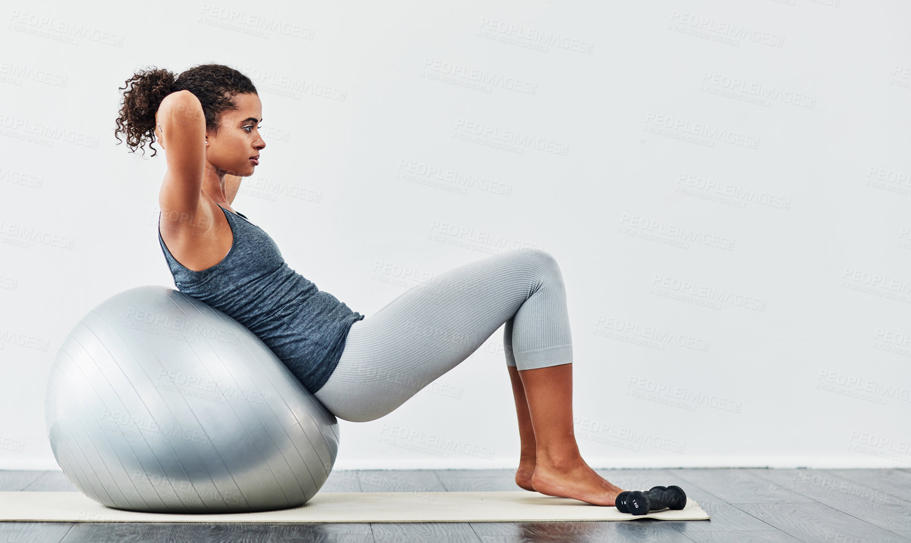 Buy stock photo Abs, ball and sit up with woman in studio on gray background for core strength, wellness or workout. Exercise, fitness and training with profile of person on floor for balance, health or stability