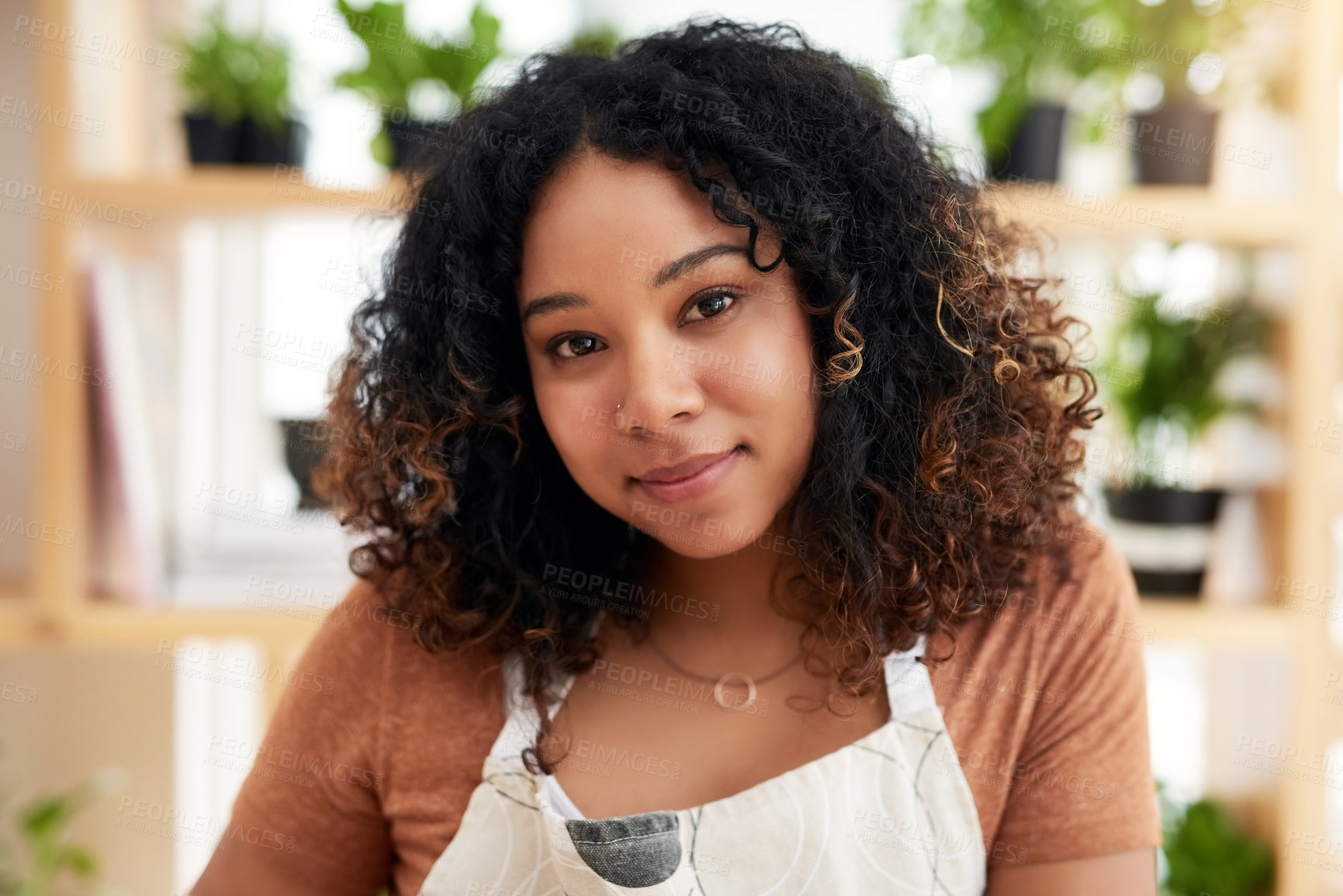 Buy stock photo Cropped portrait of an attractive young female botanist working in her florist