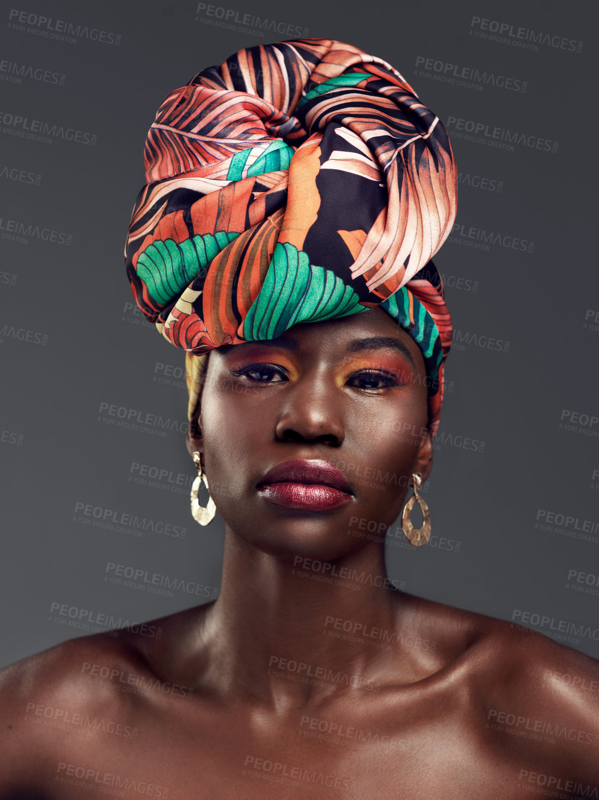 Buy stock photo Portrait, head wrap and black woman with beauty, makeup and confident model on a grey studio background. Face, female person and girl with traditional turban, cosmetics and fashion with elegance