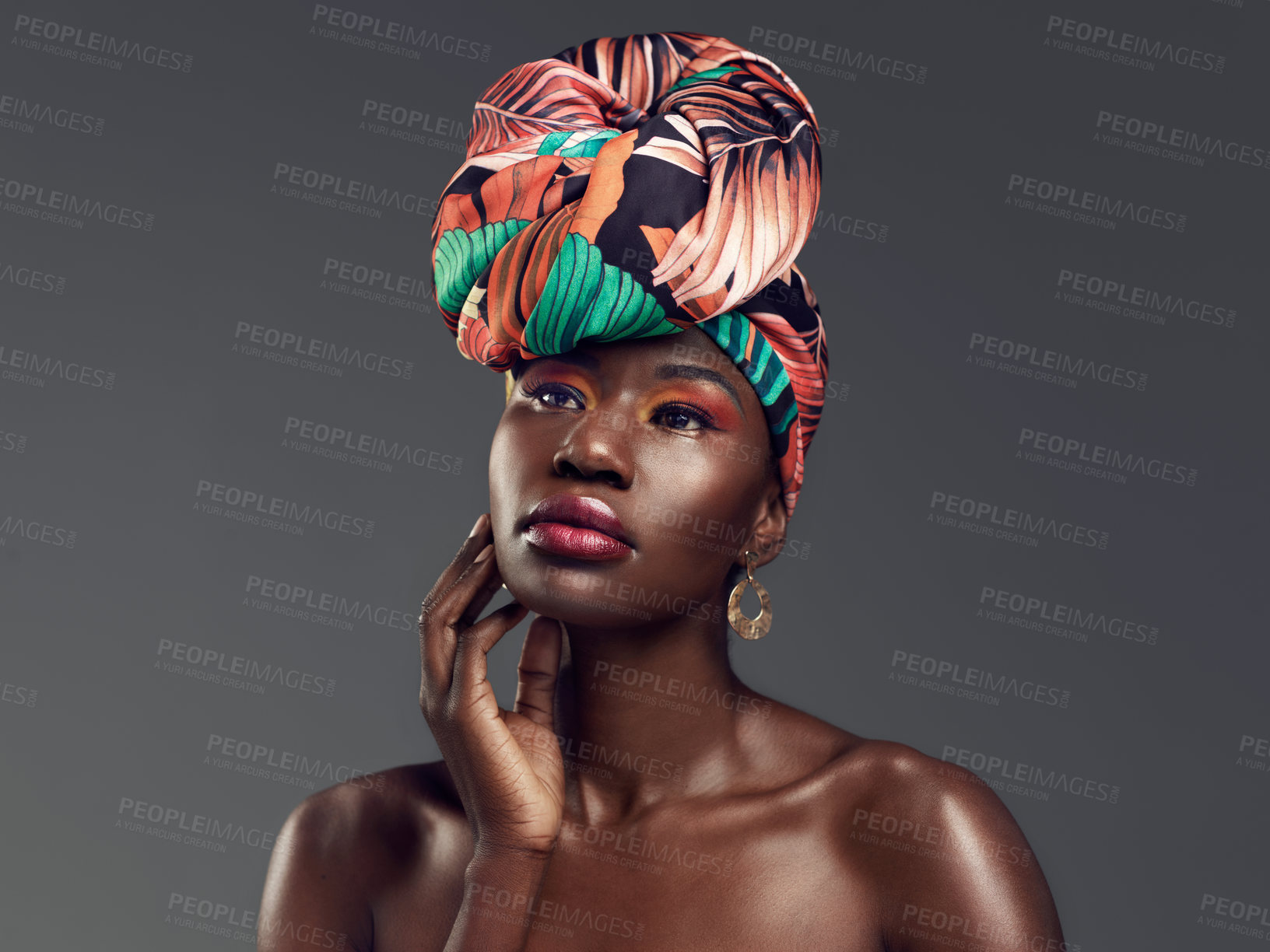 Buy stock photo Makeup, beauty and face of black woman in studio on gray background with glamour, cosmetics and luxury. Fashion, thinking and serious female person in exotic jewelry, African style and head scarf