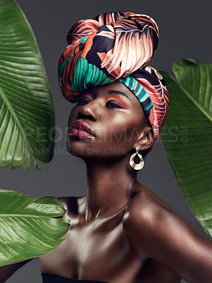 Buy stock photo Black woman in traditional turban, fashion with leaves and beauty with makeup on studio background. Natural cosmetics, nature aesthetic and female model with African head wrap, creativity and style