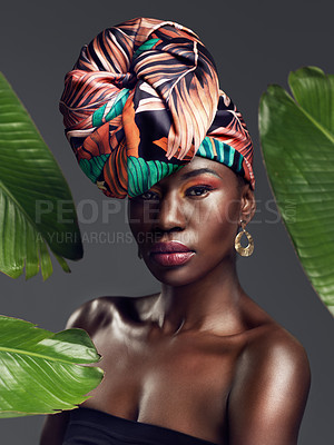 Buy stock photo Black woman in portrait in African turban, leaves and fashion with makeup and beauty on studio background. Natural cosmetics, nature aesthetic and female model on traditional head wrap with style