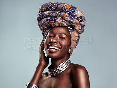 Buy stock photo Head scarf, black woman laugh and portrait with African beauty and makeup in a studio. Isolated, grey background and traditional fashion with a female model pride with culture cosmetics and jewelry