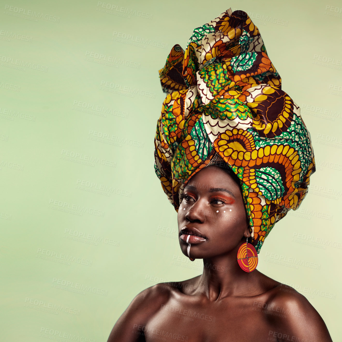 Buy stock photo Beauty, black woman and cosmetics with African turban and makeup with mockup. Isolated, green background and young female person thinking with a traditional hair scarf with confidence and culture 