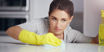 Buy stock photo Woman, face and clean kitchen table, chemical detergent spray and cloth, focus and wipe dirt. Safety with gloves, concentration and female cleaner with hygiene, cleaning and disinfecting surface