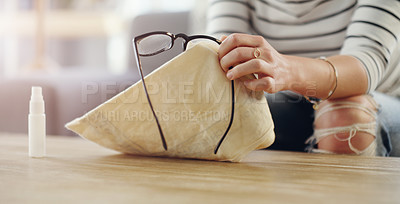 Buy stock photo Hand, woman cleaning glasses and spray with chemical liquid, cloth and hygiene with lens maintenance. Clean spectacles, eyewear and female cleaner at home with eye care and disinfectant bottle