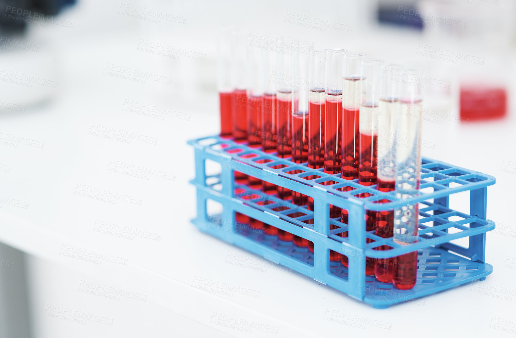 Buy stock photo Closeup of a tray with test tubes filled with blood on top of a counter inside of a laboratory