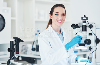 Buy stock photo Portrait of a cheerful young female scientist doing tests inside of a laboratory during the day