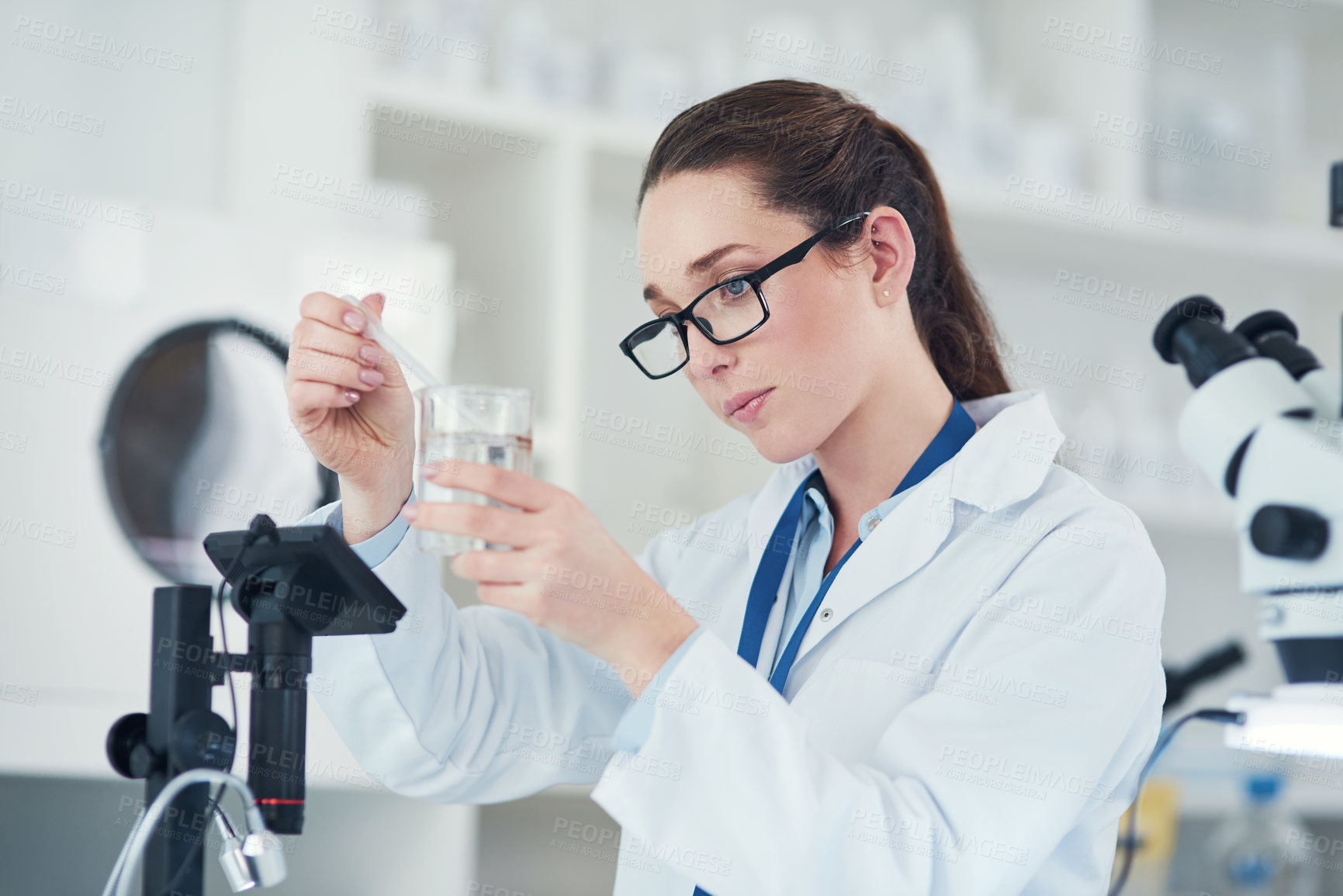 Buy stock photo Sample, pipette and scientist with research, science laboratory and biology for pharmaceutical in Denmark. Female person, healthcare and microscope in pathology, test or investigation in mpox vaccine