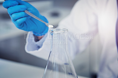 Buy stock photo Closeup of an unrecognizable scientist adding a compound into a test tube inside of a laboratory during the day