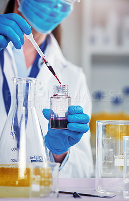 Buy stock photo Closeup of an unrecognizable scientist adding a chemical into a test tube inside of a laboratory during the day
