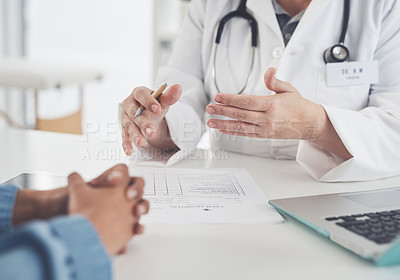 Buy stock photo Cropped shot of an unrecognizable female doctor having a discussion with a female patient in her office