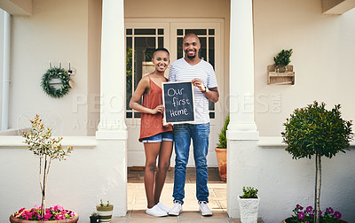 Buy stock photo Portrait of a young couple holding a chalkboard with 