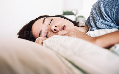 Buy stock photo Cropped shot of an attractive young woman sleeping on her bed in the morning at home