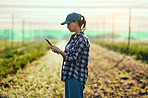 Using her tablet to manage the farm