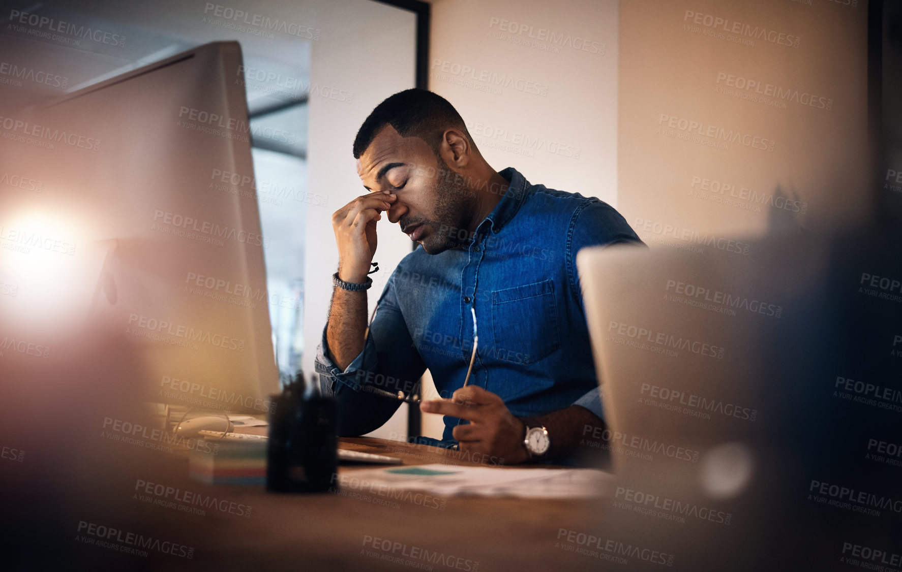 Buy stock photo Headache, eye strain and businessman in the office at night working on deadline project. Burnout, stress and professional male employee with migraine doing research on computer overtime in workplace.