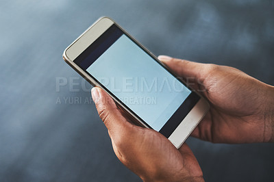 Buy stock photo Cropped shot of a woman using a smartphone in a gym