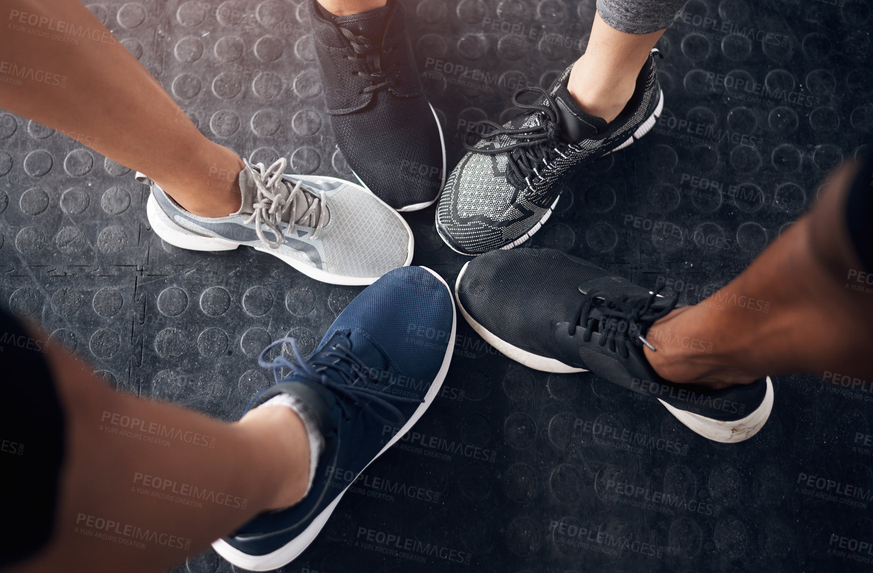 Buy stock photo Cropped shot of a group of people standing together in a circle at the gym