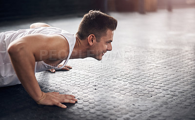 Buy stock photo Pushups, floor and man with workout in gym for power exercise, fitness endurance or strength challenge. Wellness, athlete and person lifting body weight for muscle gain, training or performance 