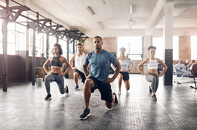 Buy stock photo People, training and lunge in group at gym for workout, core exercise or fitness together indoors. Diverse class, friends or warm up for ab muscle, session and sport for health challenge in gymnasium