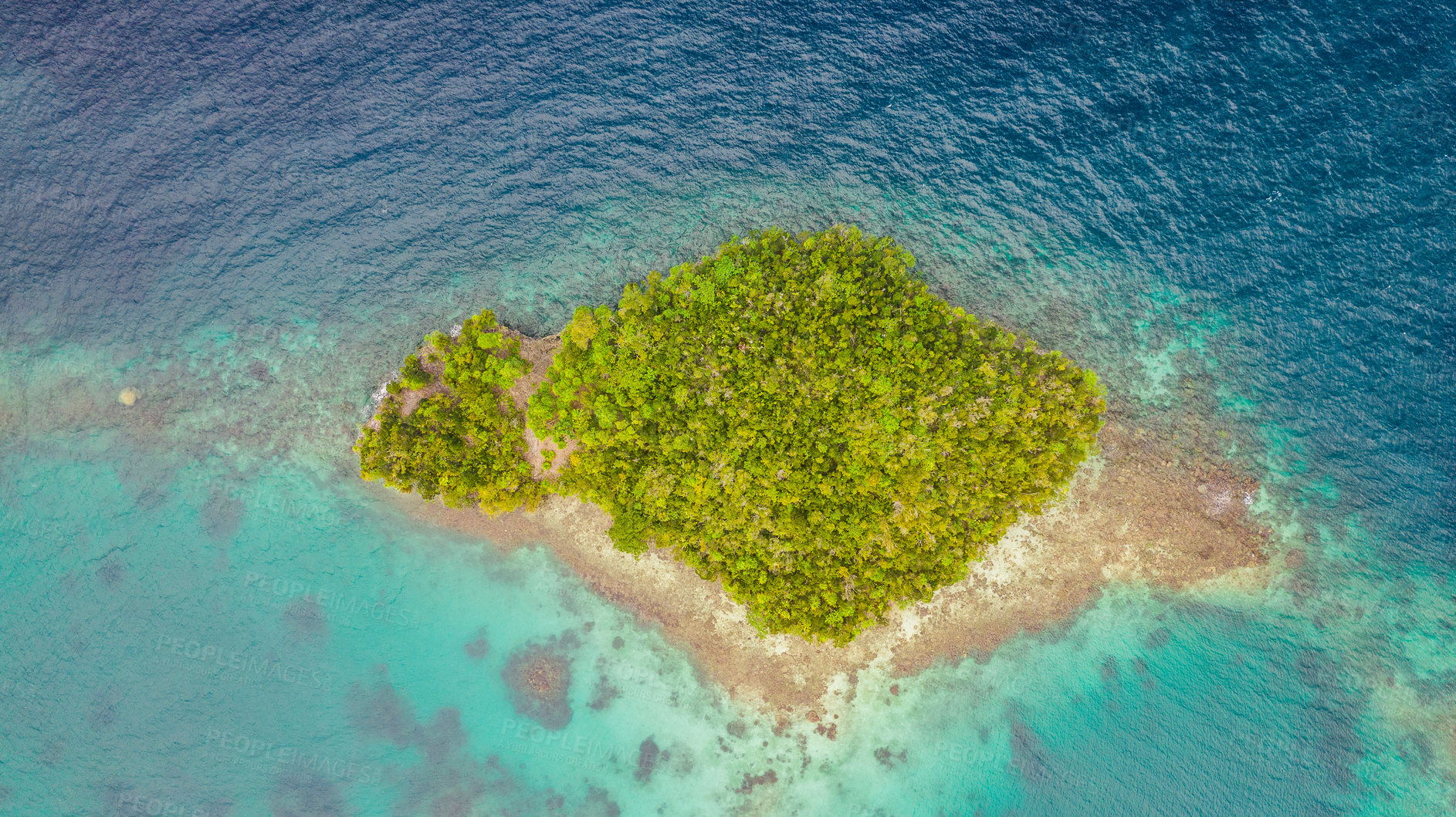 Buy stock photo High angle shot of a little islet in the middle of the wonderful Raja Ampat Islands in Indonesia