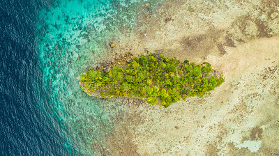 Buy stock photo High angle shot of a little islet in the middle of the wonderful Raja Ampat Islands in Indonesia
