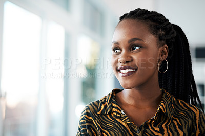 Buy stock photo Cropped shot of an attractive young businesswoman standing alone in her office during the day