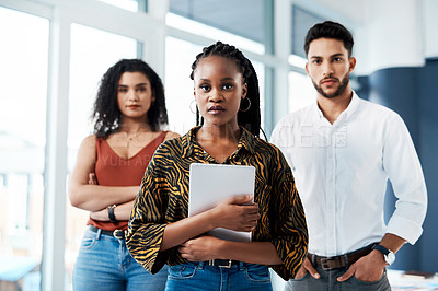 Buy stock photo Cropped portrait of an attractive young businesswoman standing in front of her colleagues and holding a tablet