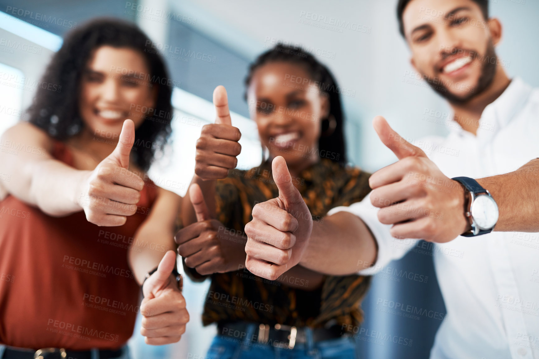 Buy stock photo Cropped portrait of a diverse group of business colleagues standing together in the office and showing a thumbs up