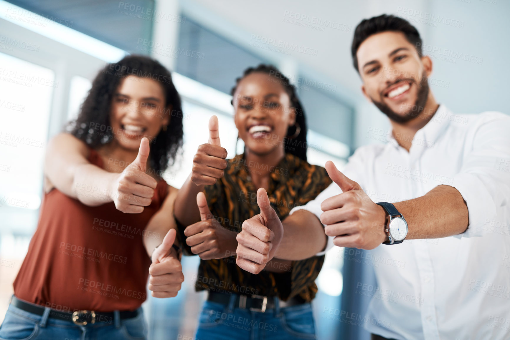 Buy stock photo Cropped portrait of a diverse group of business colleagues standing together in the office and showing a thumbs up