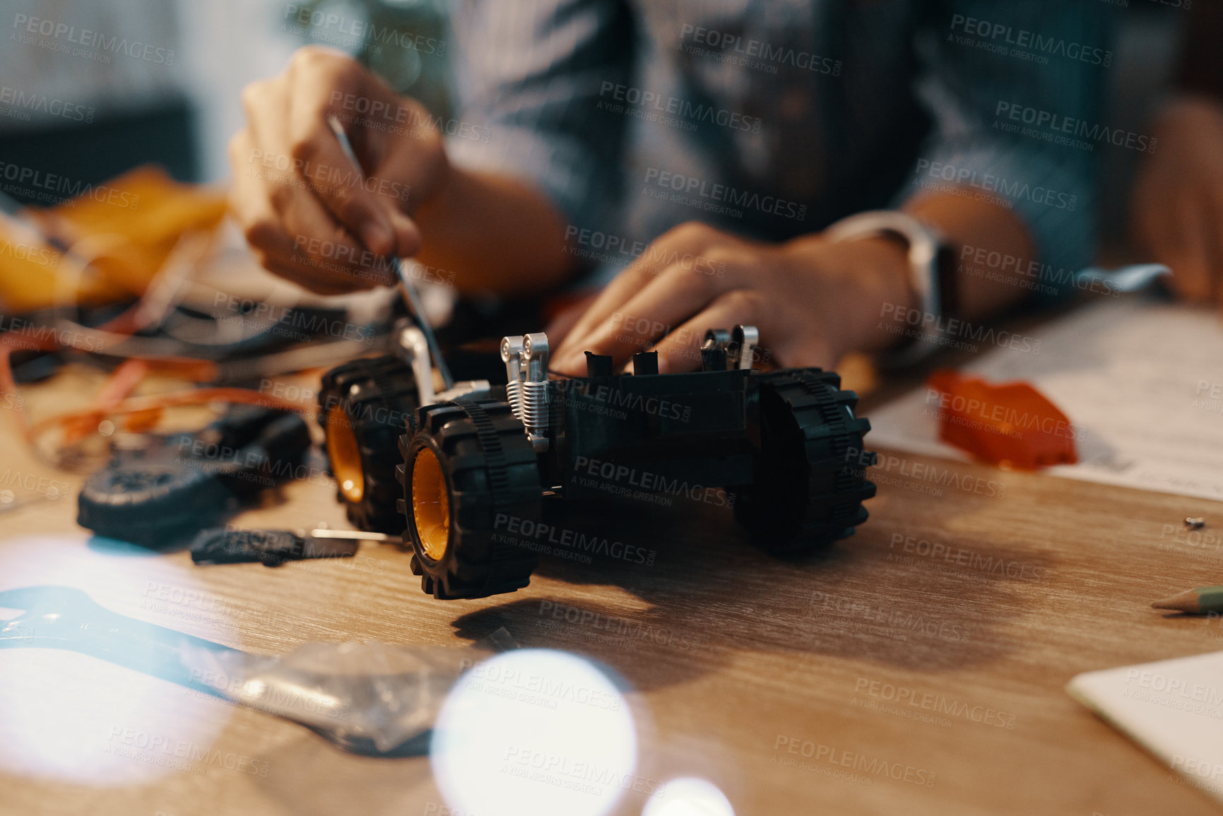 Buy stock photo Hands, person and car robotics for education with machine learning, developing and study of electronic transport. Vehicle, tools and creative engineering for stem toys, circuit building and house