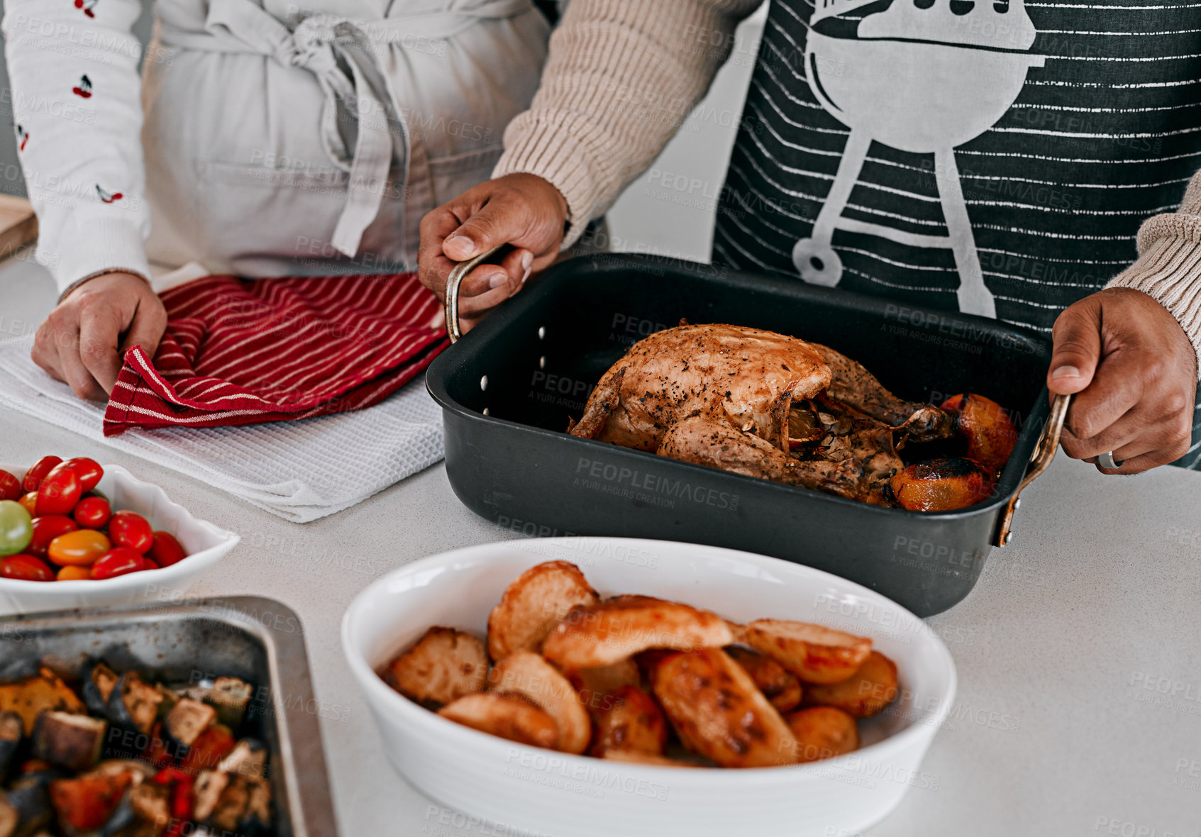 Buy stock photo Cropped shot of a couple preparing a Thanksgiving meal at home