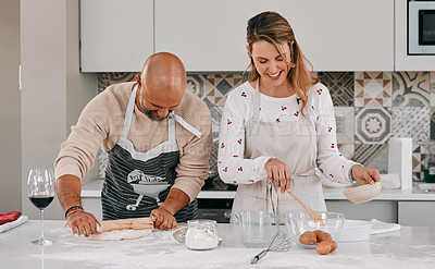 Buy stock photo Shot of a happy mature couple baking together at home