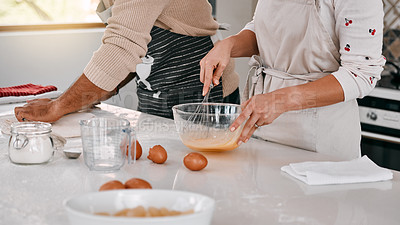 Buy stock photo Cropped shot of a couple baking together at home