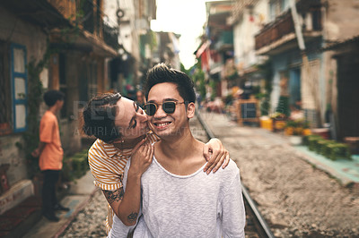 Buy stock photo Couple, happy or kiss in city for love, romantic gesture or healthy relationship with trust. Man, woman or travel on Vietnam railway for sweet moment, affectionate hug or date outing with commitment