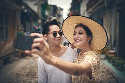 Buy stock photo Happy, travel and selfie of couple in Vietnam for holiday, vacation and adventure on honeymoon. Street, love and man and woman take photo smile for social media, memory and profile picture in city