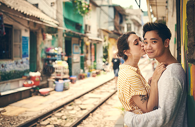 Buy stock photo Shot of a young couple sharing a romantic moment in the city of Vietnam