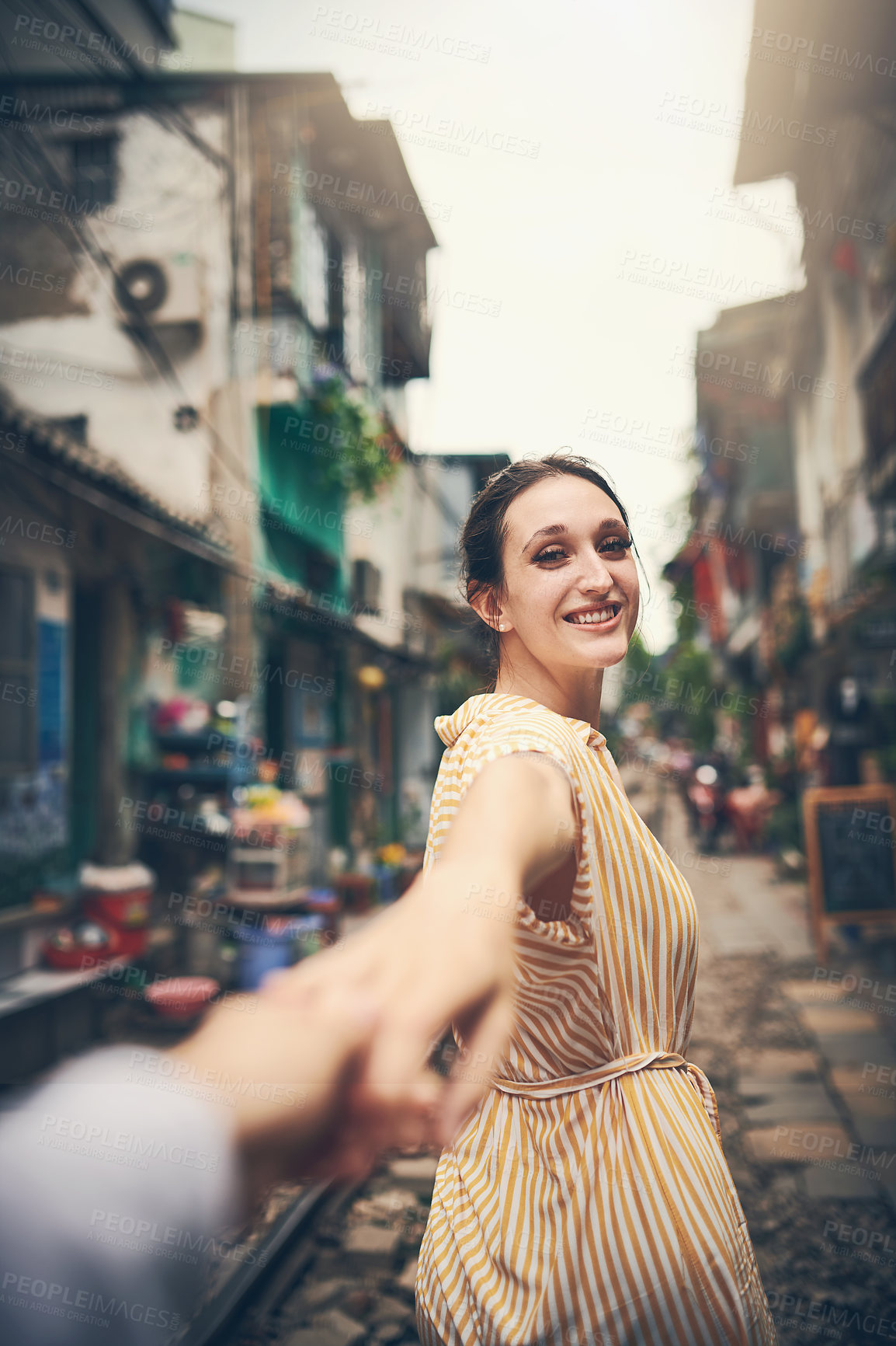 Buy stock photo Couple, love and holding hands by railway for romance, relationship and holiday adventure with portrait. People, trip and happy in Vietnam for vacation, travel and walking on date with train track