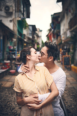 Buy stock photo Shot of a young couple sharing a romantic moment in the city of Vietnam