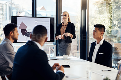 Buy stock photo Presentation, meeting and workshop with a business woman talking to her team in the office boardroom. Training, finance and education with a female coach teaching staff using a graph display at work